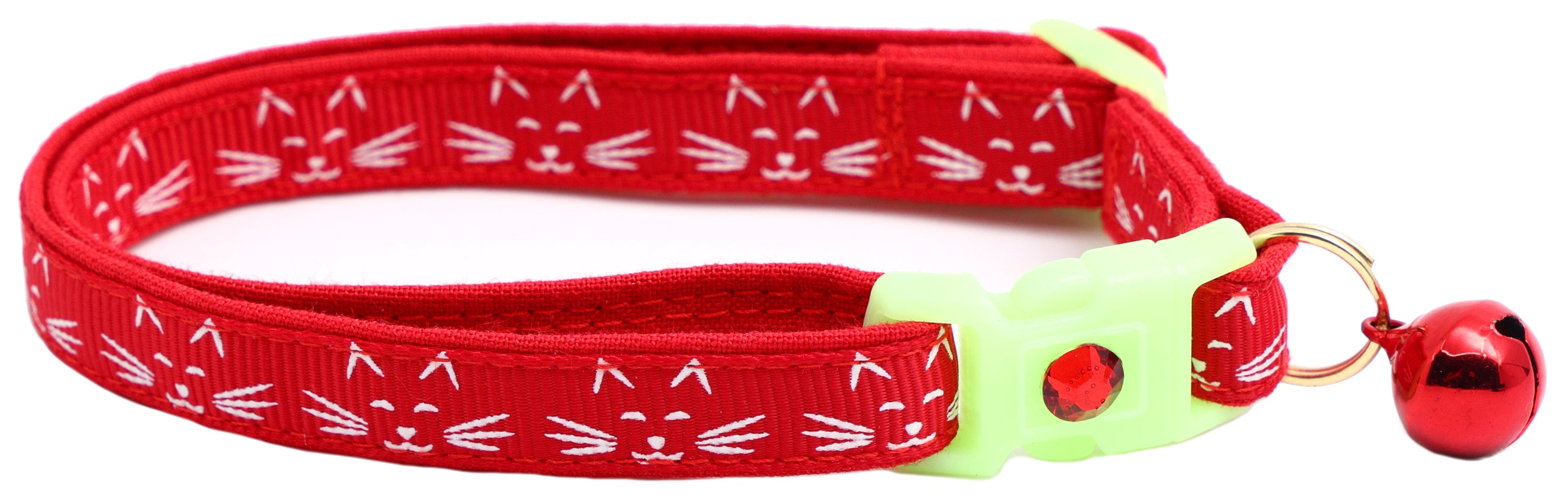 A glowing cat faces breakaway collar made of reinforced cotton, featuring a bell and charm, perfect for nighttime visibility.